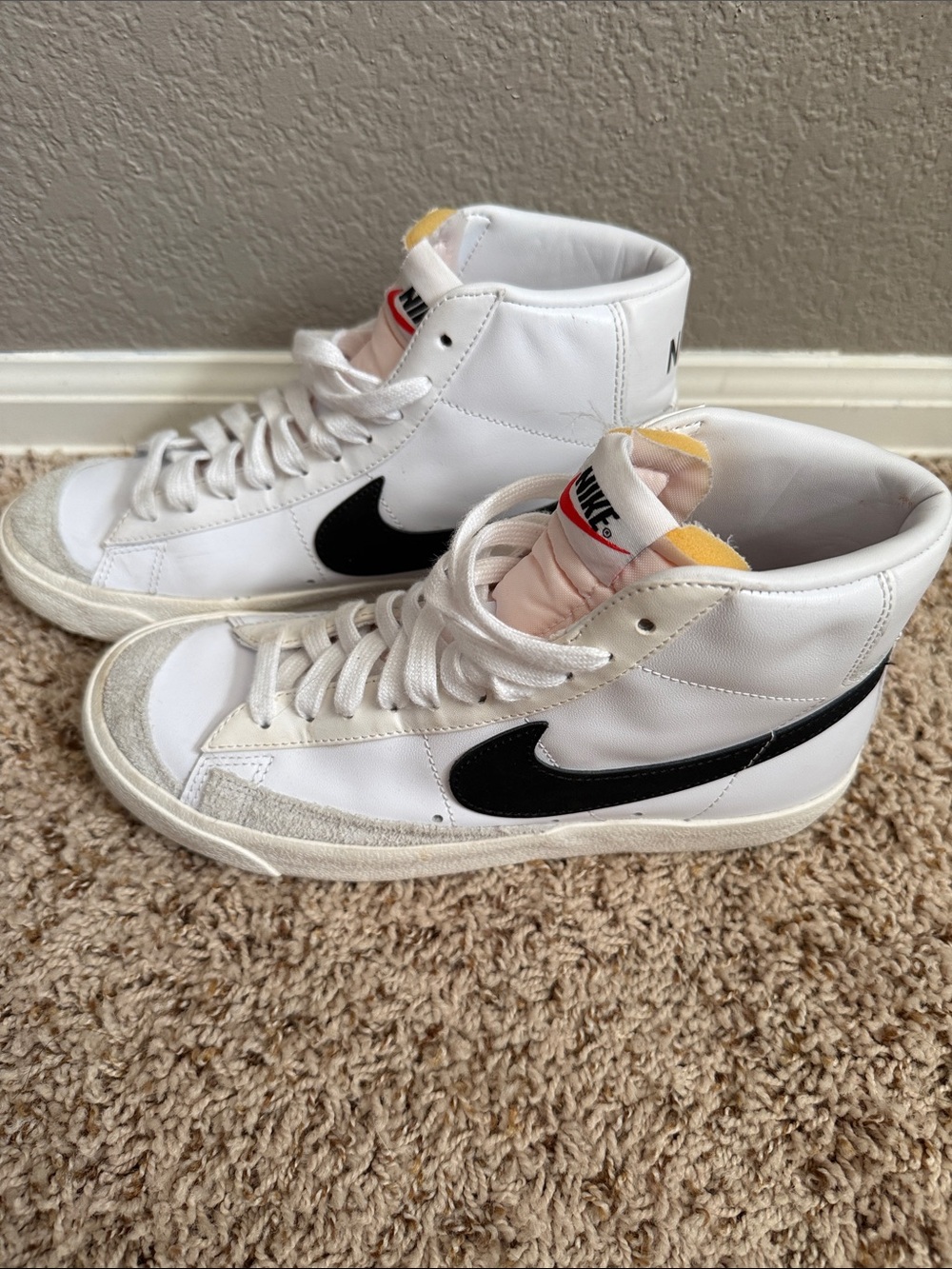 Nike White High-Top Sneakers with Black Swoosh